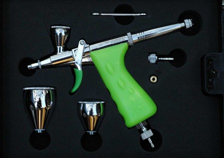 A GREX airbrush in its case.
